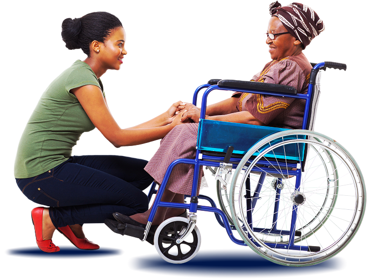 elder woman on wheelchair and caregiver smiling to each other